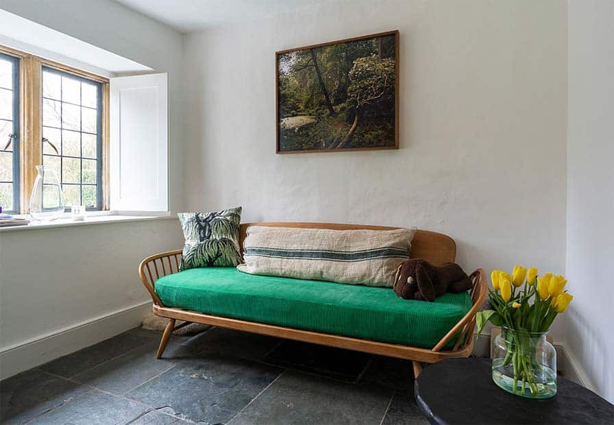 bright green corderoy box cushion on ercol sofa