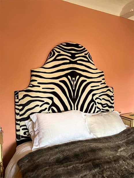 fabric covered headboard with zebra stripe material