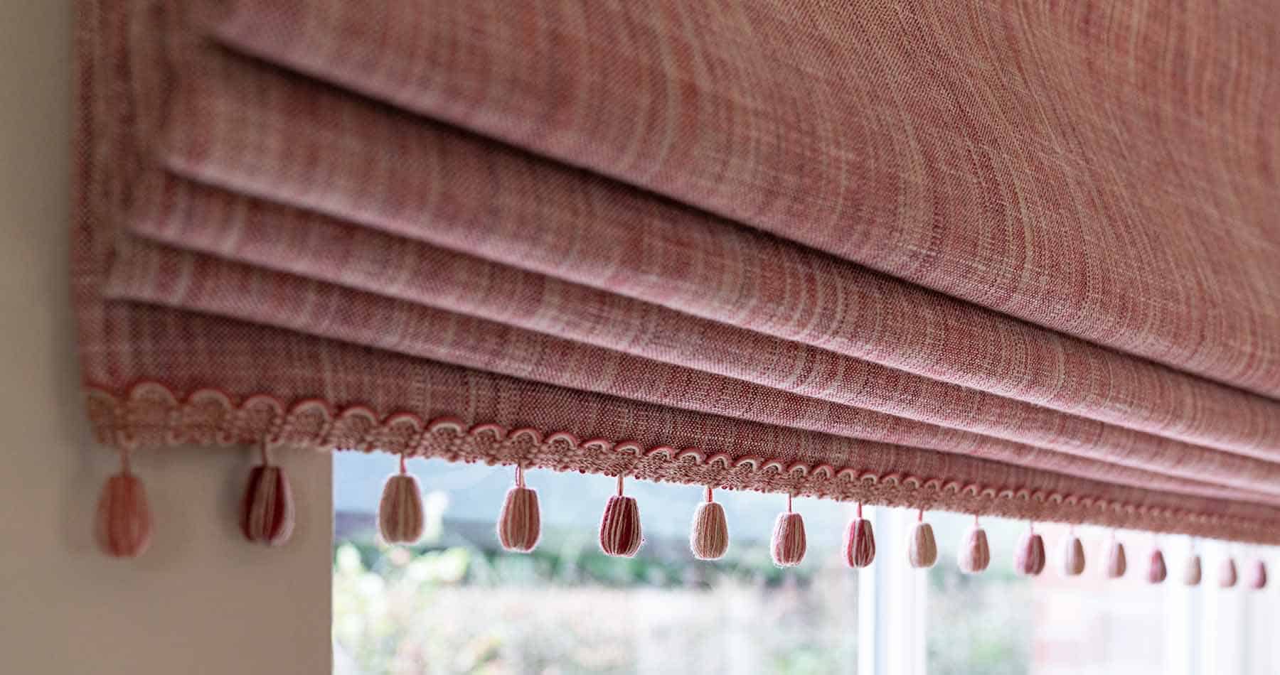 made to measure roman blind with coordinating tassel beaded edge
