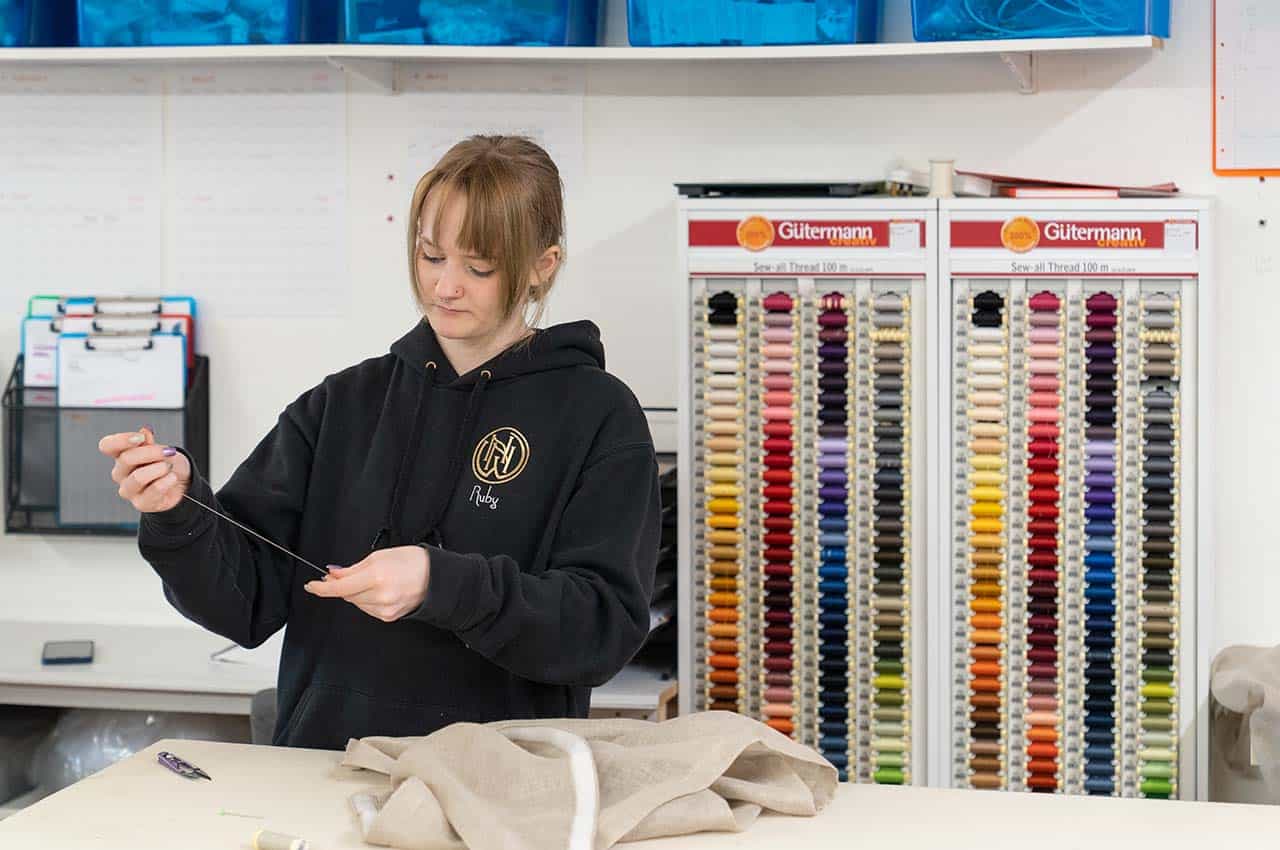 seamstress at work at curtain makers in bruton