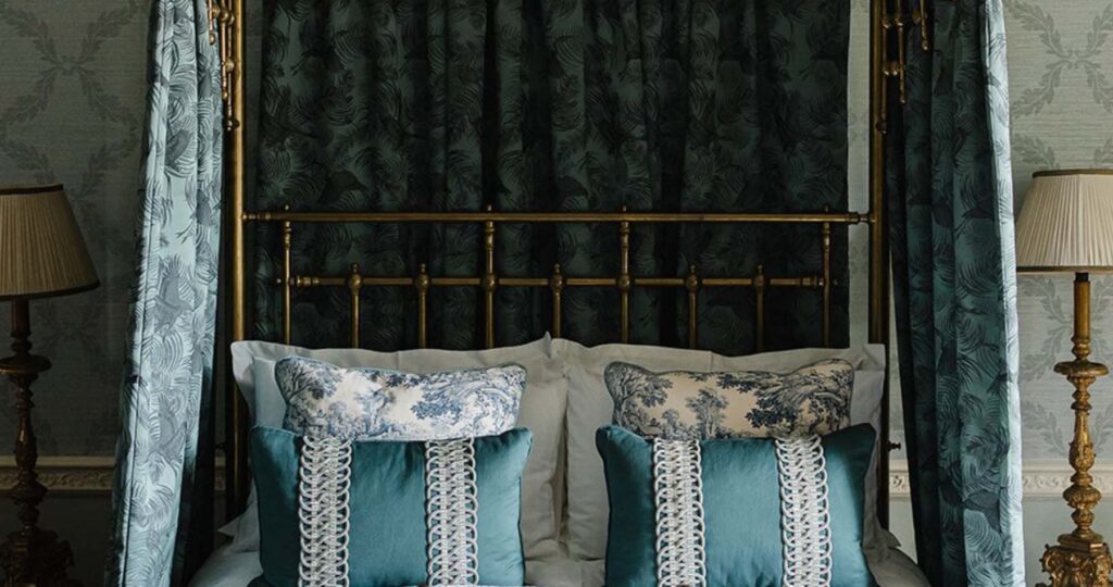 bed dressing with half tester and coordinating cushions and valance