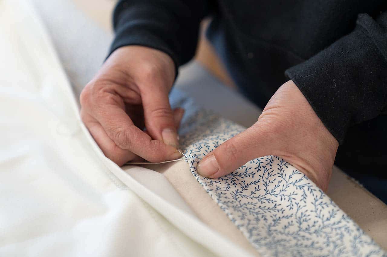 detail of hand sewing finish on curtain hem