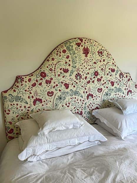 headboard covered with floral fabric