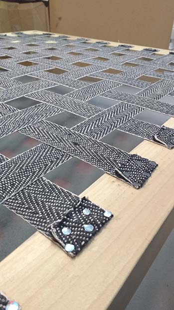webbing on frame of footstool for upholstery project