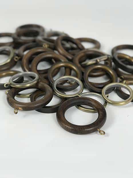assorted wooden and metal curtain rings